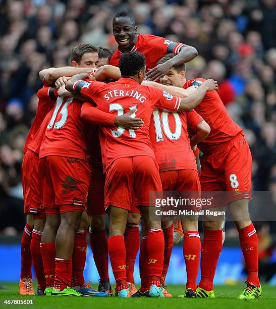 Daniel Sturridge of Liverpool celebrates with his team-mates after scoring the fourth goal during the Barclays Premier League match between Liverpool...