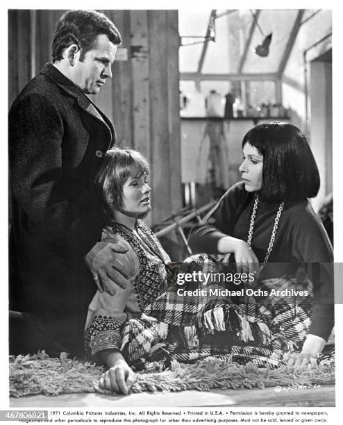 Actor Ian Holm, actresses Jennie Linden and Claire Bloom on set of the movie "A Severed Head ", circa 1970.