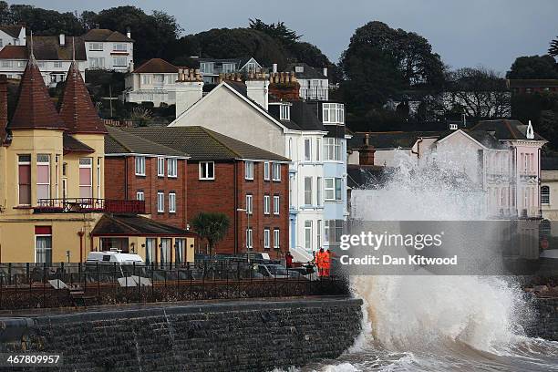 Waves crash over the main Exeter to Plymouth railway line that has been closed due to parts of it being washed away by the sea on February 8, 2014 in...