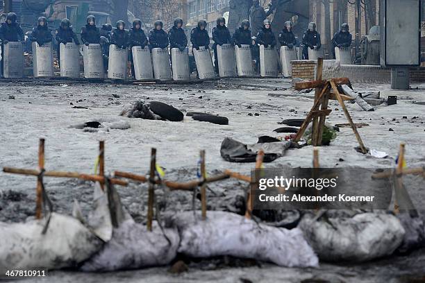 Anti-government protester set up crosses to show the violance and death of their fellow campaigners behind a barricade on Hrushevskoho Street on...