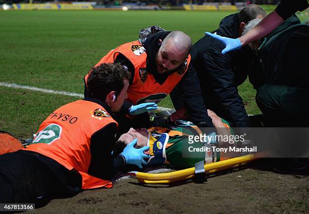 George North of Northampton Saints receives treatment after scoring a try and colliding with Nathan Hughes of Wasps during the Aviva Premiership...