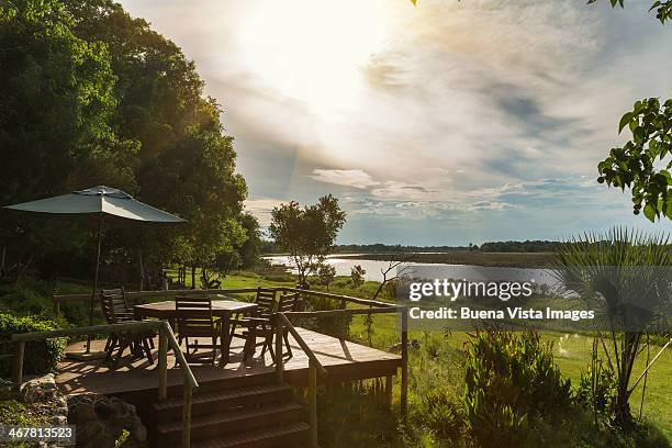 luxury lodge on the okavango river. - okawangodelta stock-fotos und bilder