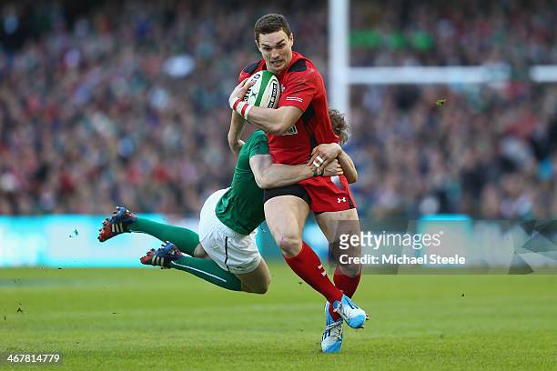 George North of Wales is tackled by Andrew Trimble of Ireland during the RBS Six Nations match between Ireland and Wales at the Aviva Stadium on...