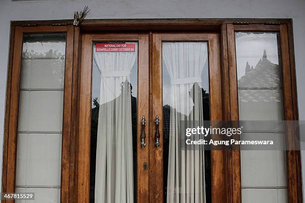 Sticker attached on a glass door of a house where Australian drug trafficker Schapelle Corby's sister and brother in law, Mercedes Corby and Wayan...