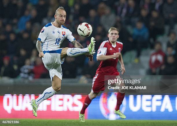 Slovakia's Miroslav Stoch plays the ball during the EURO 2016 Group C qualifier football match Slovakia vs Luxembourg in Zilina, Slovakia on March...