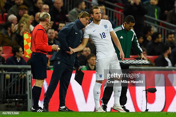 Harry Kane of England is spoken too by Dave Watson, England Goalkeeping coach on the side during the EURO 2016 Qualifier match between England and...