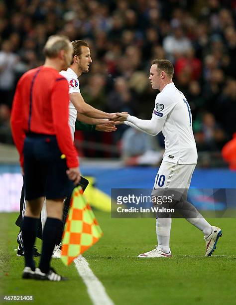 Wayne Rooney of England is substituted with Harry Kane of England for his debut during the EURO 2016 Qualifier match between England and Lithuania at...