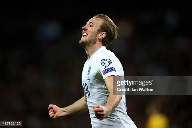 Harry Kane of England celebrates after scoring on his debut during the EURO 2016 Qualifier match between England and Lithuania at Wembley Stadium on...