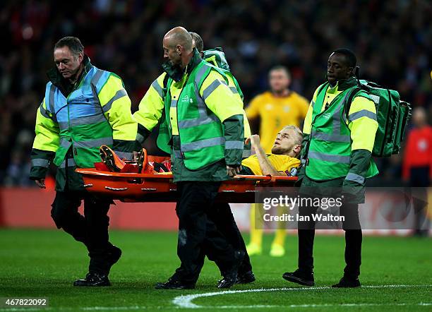 Vytautas Andriuskevicius of Lithuania is taken off on a stretcher during the EURO 2016 Qualifier match between England and Lithuania at Wembley...