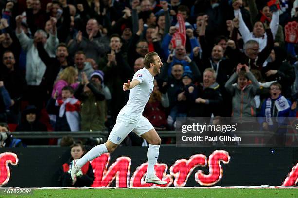 Harry Kane of England celebrates after scoring on his debut during the EURO 2016 Qualifier match between England and Lithuania at Wembley Stadium on...