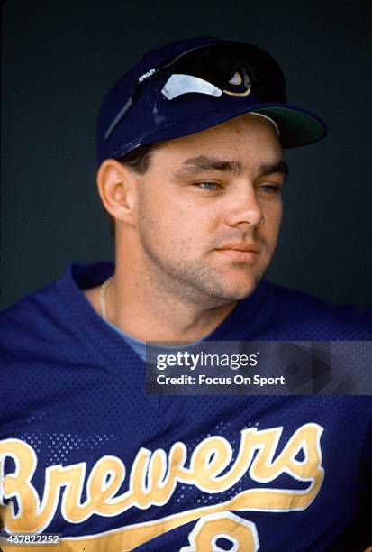 Dante Bichette of the Milwaukee Brewers looks on from the dugout prior to the start of a Major League Baseball game circa 1992. Bichette played for...