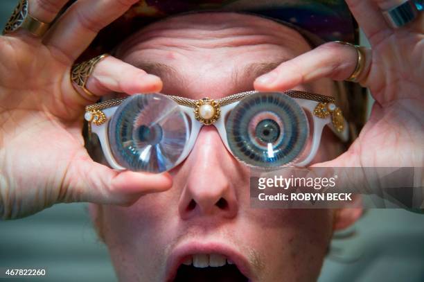 By Guillaume Meyer, Lifestyle-US-dance Dancer Alan Crossley models Future Eyes kaleidoscope prism glasses at the Daybreaker LA morning dance party at...