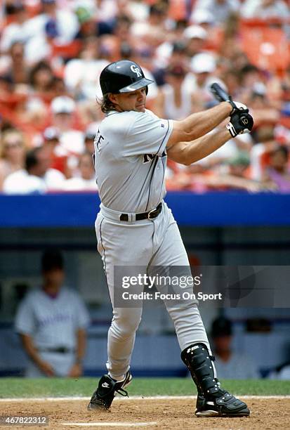 Dante Bichette of the Colorado Rockies bats against the New York Mets during an Major League Baseball game circa 1995 at Shea Stadium in the Queens...