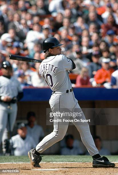 Dante Bichette of the Colorado Rockies bats against the New York Mets during an Major League Baseball game circa 1993 at Shea Stadium in the Queens...