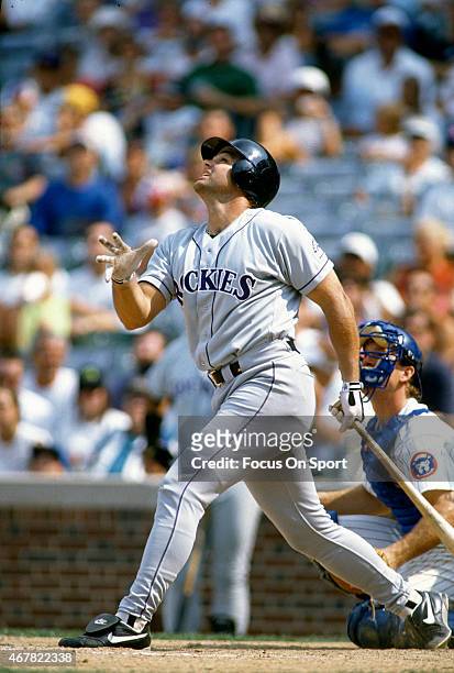 Dante Bichette of the Colorado Rockies bats against the Chicago Cubs during an Major League Baseball game circa 1993 at Wrigley Fields in Chicago,...