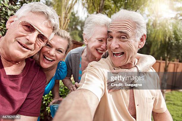 group of senior people taking selfie - summer comedies party stockfoto's en -beelden