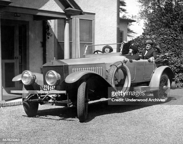 Movie star Mabel Normand behind the wheel in Raymond Hitchcock's Rolls Royce at their estate on Long Island, Great Neck, New York, September 19, 1921.