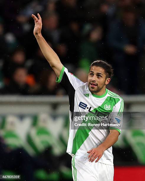 Ricardo Rodriguez of Wolfsburg celebrates scoring his teams opening goal with Christian Traesch of Wolfsburg during the Bundesliga match between VfL...