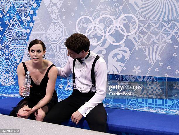 Anna Cappellini and Luca Lanotte of Italy look on after competing in the Figure Skating Team Ice Dance - Short Dance during day one of the Sochi 2014...