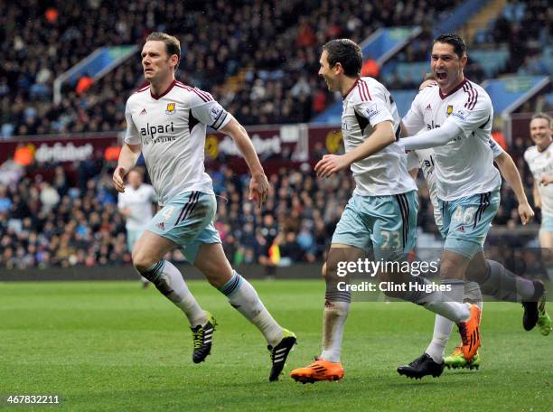 Kevin Nolan of West Ham United celebrates after he scores the second goal of the game for his side during the Barclays Premier League match between...