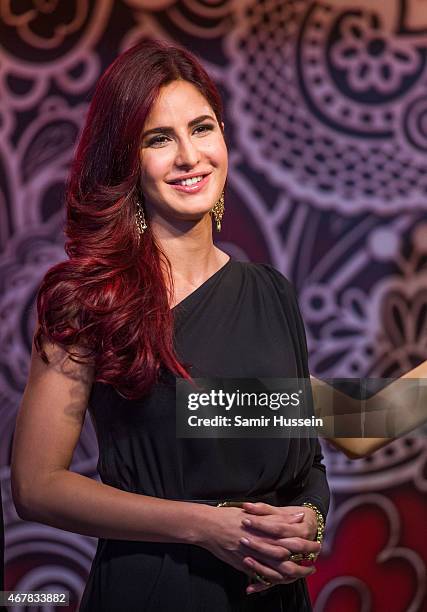 Katrina Kaif attends a photocall to unveil her new wax figure at Madame Tussauds on March 27, 2015 in London, England.