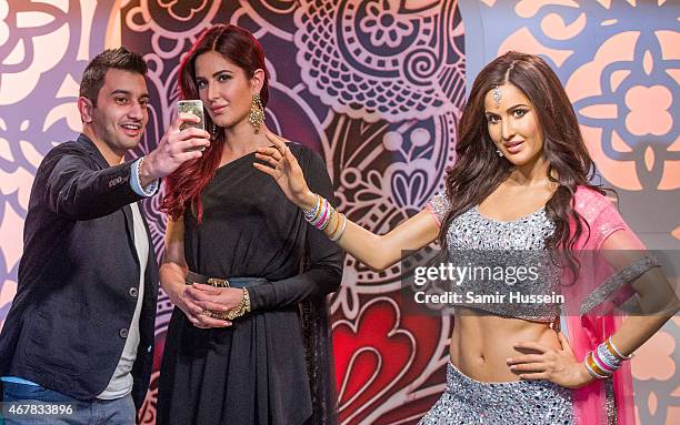 Katrina Kaif attends a photocall to unveil her new wax figure at Madame Tussauds on March 27, 2015 in London, England.