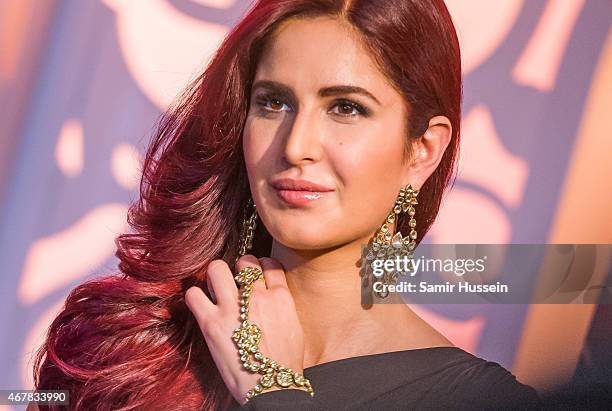 Katrina Kaif attends a photocall to unveil her new wax figure at Madame Tussauds on March 27, 2015 in London, England.