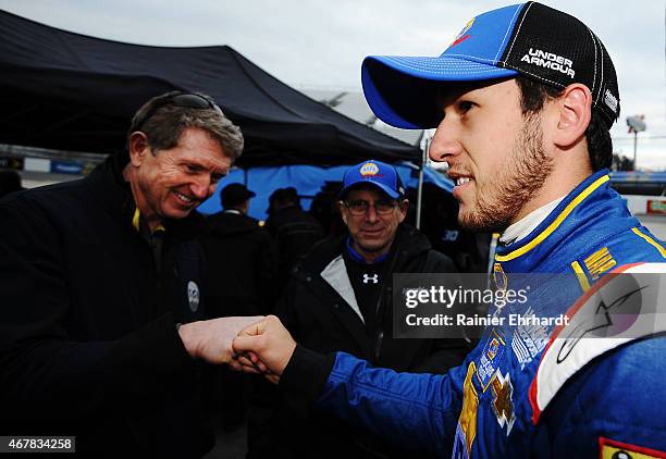 Hall of Famer Bill Elliott congratulates his son Chase Elliott, driver of the NAPA AUTO PARTS Chevrolet, after qualifying for the NASCAR Sprint Cup...