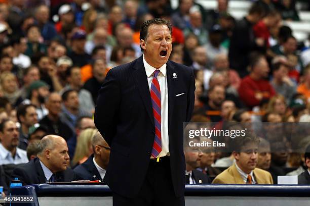 Head coach Mark Gottfried of the North Carolina State Wolfpack shouts against the Louisville Cardinals in the first half of the game during the East...