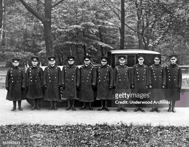 Queen Marie of Romania has a squadron of chauffeurs at her beck and call during her visit, October 19, 1926. The limousine is a 1926 Packard with a...