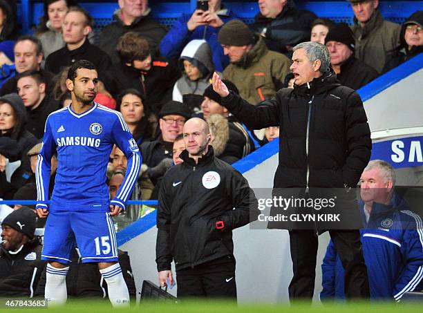 Chelsea's Portuguese manager Jose Mourinho gives instructions to Chelsea's Egyptian midfielder Mohamed Salah during the English Premier League...