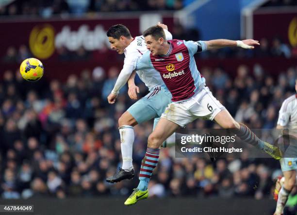 Ciaran Clark of Aston Villa and Marco Borriello of West Ham United contest a header during the Barclays Premier League match between Aston Villa and...