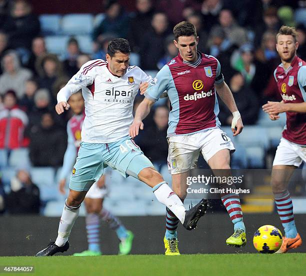 Ciaran Clark of Aston Villa and Marco Borriello of West Ham United battle for the ball during the Barclays Premier League match between Aston Villa...