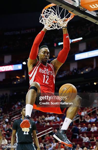 Dwight Howard of the Houston Rockets dunks the basketball during their game against the Minnesota Timberwolves at the Toyota Center on March 27, 2015...