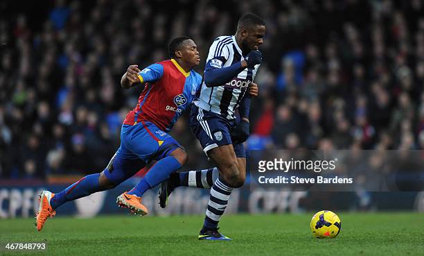 Kagisho Dikgacoi of Crystal Palace attempts to tackle Victor Anichebe of West Bromwich Albion during the Barclays Premier League match between...
