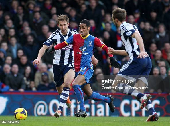 Thomas Ince of Palace vies with Craig Dawson of West Brom defence ...
