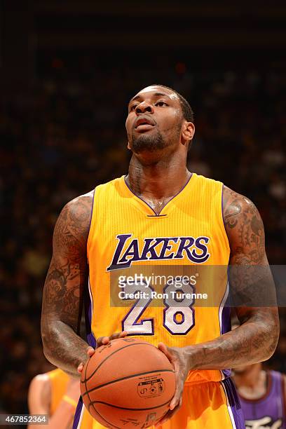 Tarik Black of the Los Angeles Lakers shoots against the Toronto Raptors during the game on March 27, 2015 at Verizon Center in Toronto, Canada. NOTE...