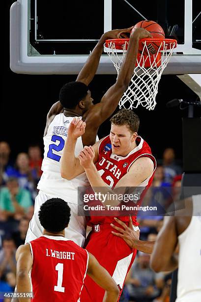 Amile Jefferson of the Duke Blue Devils dunks over Jakob Poeltl of the Utah Utes during a South Regional Semifinal game of the 2015 NCAA Men's...