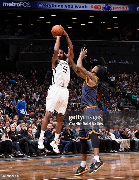 Earl Clark of the Brooklyn Nets shoots against the Cleveland Cavaliers on March 27, 2015 at the Barclays Center in the Brooklyn borough of New York...