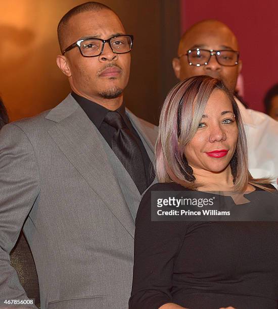 Cliffors 'T.I.' Harris and Tameka 'Tiny' Harris attend 925 Scales Ribbon Cutting Ceremony at 925 Scales on March 27, 2015 in Atlanta, Georgia.
