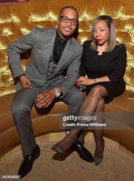 Cliffors 'T.I.' Harris and Tameka 'Tiny' Harris attend 925 Scales Ribbon Cutting Ceremony at 925 Scales on March 27, 2015 in Atlanta, Georgia.
