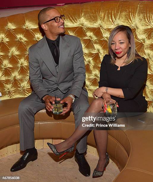 Cliffors 'T.I.' Harris and Tameka 'Tiny' Harris attend 925 Scales Ribbon Cutting Ceremony at 925 Scales on March 27, 2015 in Atlanta, Georgia.