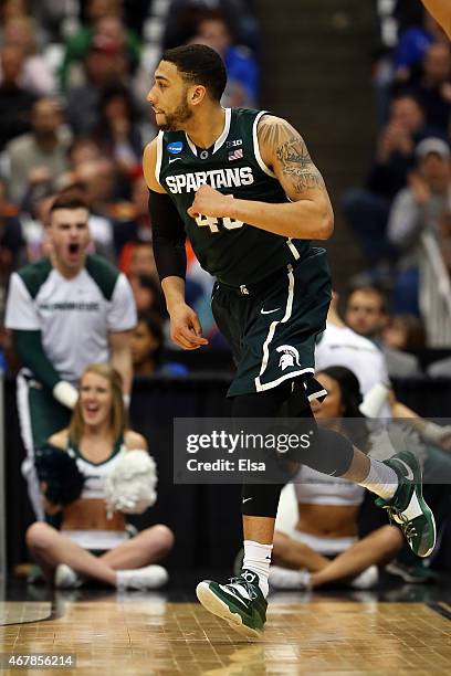 Denzel Valentine of the Michigan State Spartans reacts after a basket in the second half of the game against the Oklahoma Sooners during the East...