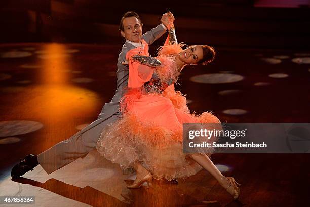 Ralf Bauer and Oana Nechiti perform on stage during the 3rd show of the television competition 'Let's Dance' on March 27, 2015 in Cologne, Germany.