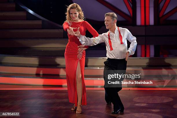 Katja Burkhard and Paul Lorenz perform on stage during the 3rd show of the television competition 'Let's Dance' on March 27, 2015 in Cologne, Germany.