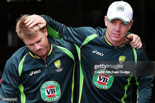 David Warner and Xavier Doherty hug when walking out during an Australian nets session at Melbourne Cricket Ground on March 28, 2015 in Melbourne,...