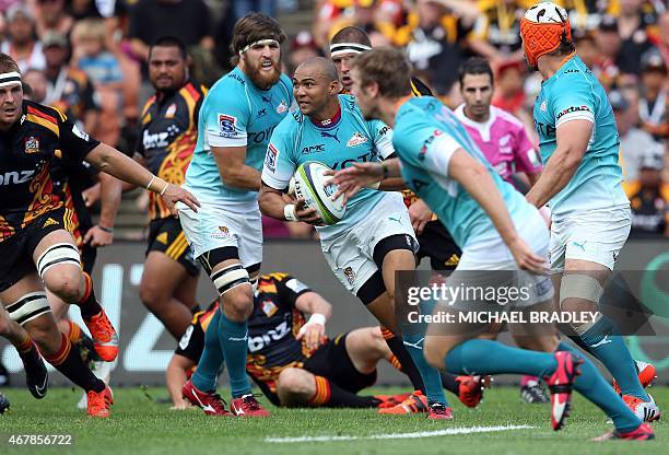 Central Cheetahs' Cornal Hendricks runs the ball forward during the Super 15 rugby match between the Waikato Chiefs and the Central Cheetahs at...