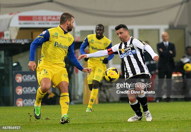 Antonio Di Natale of Udinese Calcio competes with Michele Canini of Chievo Verona during the Serie A match between Udinese Calcio and AC Chievo...