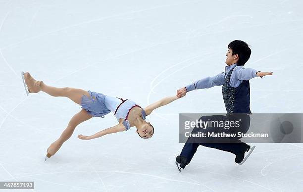 Narumi Takahashi and Kihara Ryuichi of Japan compete in the Figure Skating Team Pairs Free Skating during day one of the Sochi 2014 Winter Olympics...