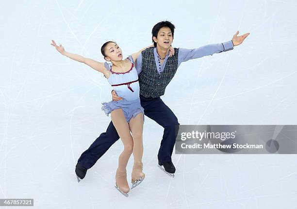 Narumi Takahashi and Kihara Ryuichi of Japan compete in the Figure Skating Team Pairs Free Skating during day one of the Sochi 2014 Winter Olympics...